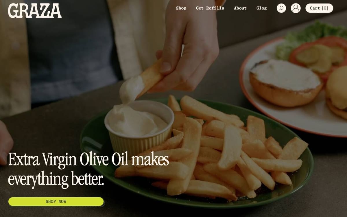 Graza homepage on a desktop screen: a full-width photo of fries being dipped, the headline Extra Virgin Olive Oil makes everything better and a Shop Now button