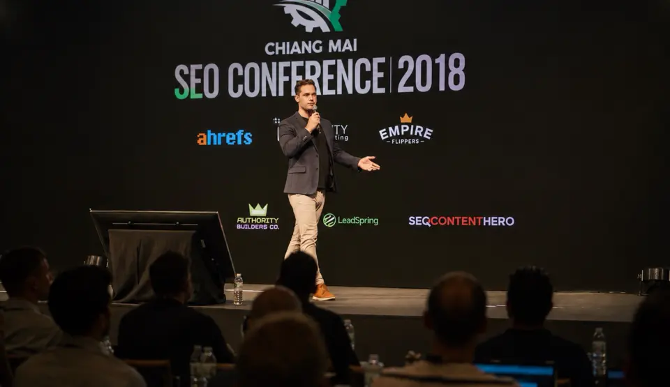 Kurt Philip speaking on stage at the Chiang Mai SEO Conference 2018